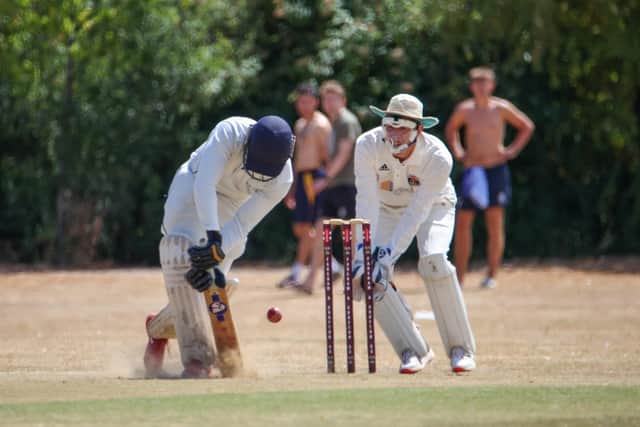 Fareham & Crofton keeper Jeremy Bulled watches Carlin Joy bat for Portsmouth. Picture by Alex Shute.