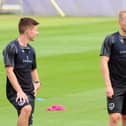 Anthony Scully (right) with Tom Lowery on the first day of Pompey pre-season training on Thursday. Picture: Sarah Standing (290623-8847)