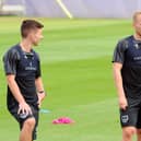 Anthony Scully (right) with Tom Lowery on the first day of Pompey pre-season training on Thursday. Picture: Sarah Standing (290623-8847)