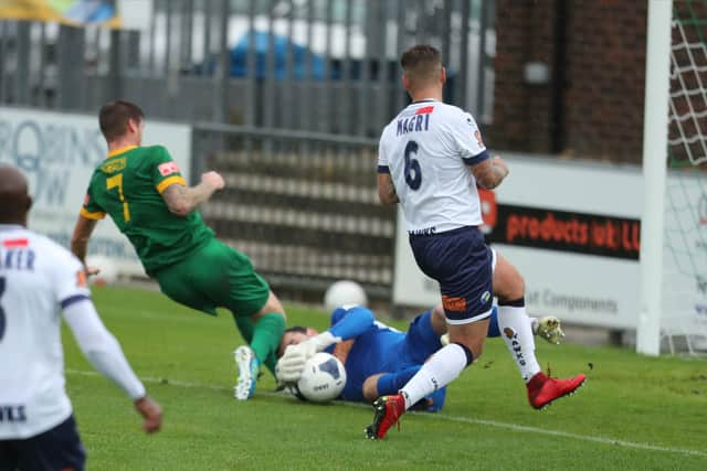 Hawks goalkeeper Ross Worner gets a shin in face from Rob O'Toole that was to force him off at half-time against Horsham. Picture: Dave Haines.