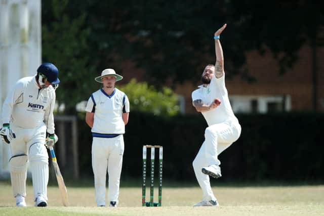 Ant Norris bowling for Emsworth in their Hampshire District League victory over Hayling Island. Picture: Chris Moorhouse