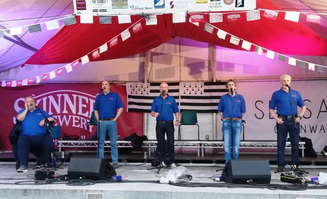 The Portsmouth Shantymen performing on Falmouth main stage 2019