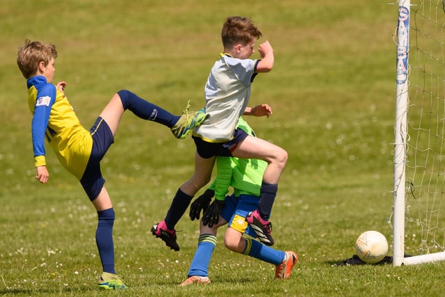Action from the Clanfield youth football tournament at Horndean Technology College. Picture: Keith Woodland (270521-433)