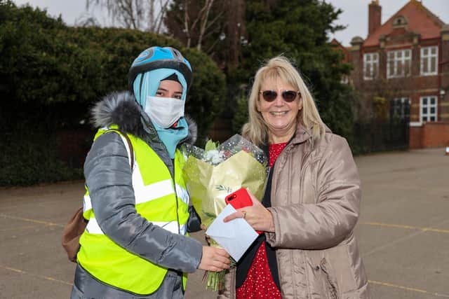 Portsmouth and Southsea Rotary Club president Caroline Gwatkin with one of the asylum seekers Picture: Alex Shute