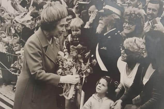 A four-year-old Julie Tipler looking up at Her Majesty Queen Elizabeth II as she visited the Fratton Community Centre in Fratton.