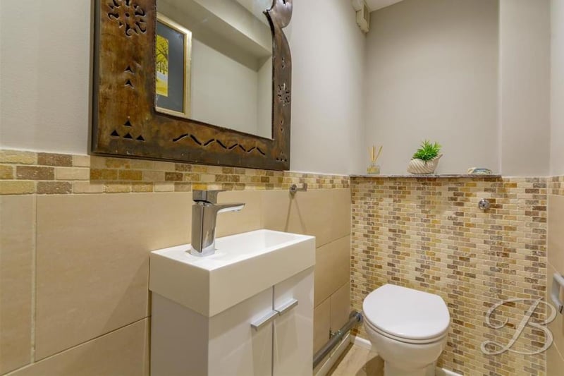 Even the toilet has a touch of class about it. A low-flush WC is complemented by a pedestal wash basin.