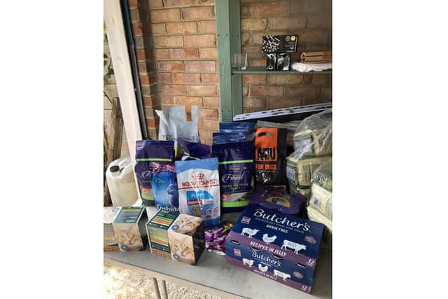 Mary Burgess, founder of Pet Connect UK, has set up the Pet Connect Pet Food Bank to help owners who are struggling to buy food for their pets. Pictured: Donations of food ready to be delivered