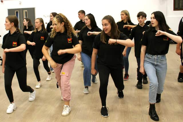 Stage One musical theatre group in rehearsals for their upcoming stage hit We Will Rock You.