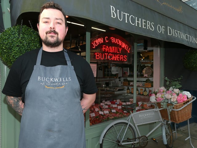 Buckwells of Southsea, in Osborne Road, Southsea, has a 4.5 star rating on Google from 63 reviews. Pictured is butcher Tom Bridle with the window display. Picture: Chris Moorhouse.