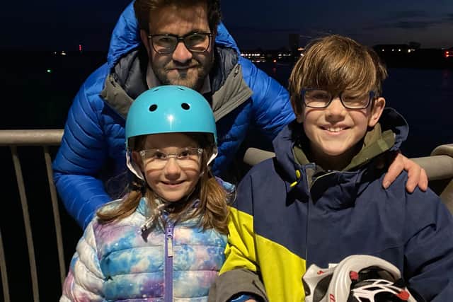David Armstrong, of Wickham, pictured with his children Eva, eight, and Henry, 11, at the Hot Walls to watch as wife and mum Surgeon Commander Amanda Armstrong deploy on HMS Queen Elizabeth. Photo: Tom Cotterill