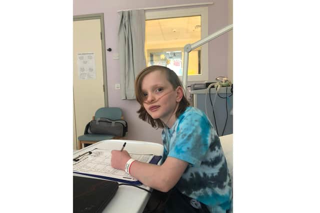 Sam Merrick, 11, was the inspiration for Sam's Haven, a charity set up by his family to help other ill children. Pictured in hospital being treated for a leg abscess in March 2020