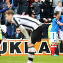 Jamal Lowe celebrates with Michael Doyle and Conor Chaplin after netting his second goal against Notts County as Pompey win promotion at Meadow Lane in April 2017. Picture: Joe Pepler