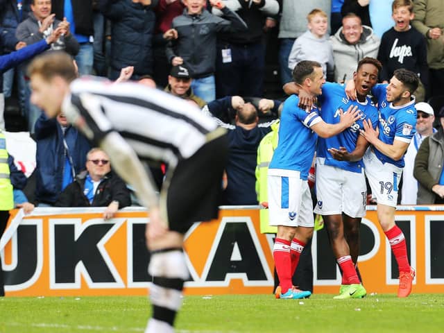 Jamal Lowe celebrates with Michael Doyle and Conor Chaplin after netting his second goal against Notts County as Pompey win promotion at Meadow Lane in April 2017. Picture: Joe Pepler