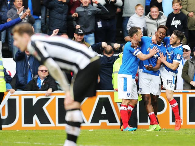 Jamal Lowe celebrates with Michael Doyle and Conor Chaplin after netting his second goal against Notts County as Pompey win promotion at Meadow Lane in April 2017. Picture: Joe Pepler