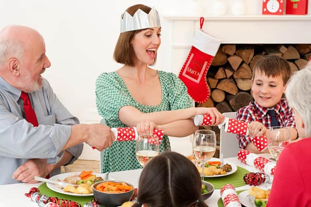Family enjoying Christmas dinner. Picture: Getty Images