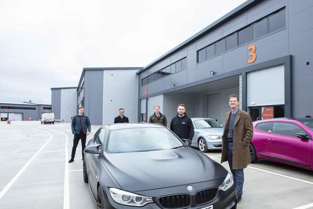 Car wrapping specialist Amigo Wraps is the first company to move into one of 10 units at brand-new Concorde Park, Segensworth. From left, Russell Mogridge of Vail Williams, Amigo Wraps owner Alan Gonzalez, Ollie Sherriff of CBRE, Mark Hooper, development director at Kingsbridge Estates, and Alex Gauntlett of Vail Williams.