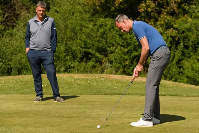 Former Portsmouth GC pro player Jason Banting sinks the final putt to bring the 50th anniversary competition to a close Picture: Keith Woodland (140521-1)