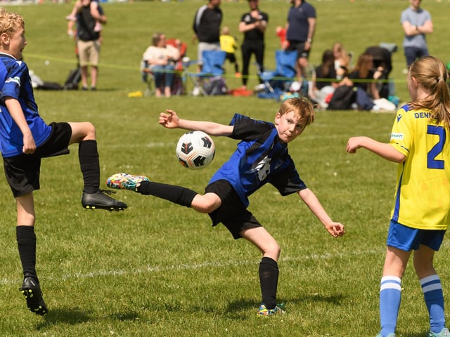 Action from the Clanfield youth football tournament at Horndean Technology College. Picture: Keith Woodland (270521-757)