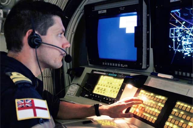 David Roberts pictured as a Fighter Controller in the ops room of French aircraft carrier FS Charles de Gaulle in 2014.