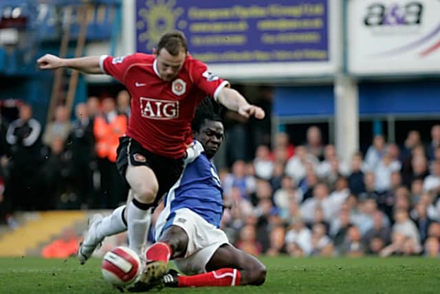 Linvoy Primus gets the better of Wayne Rooney during a Premier League encounter. Picture: Barry Zee
