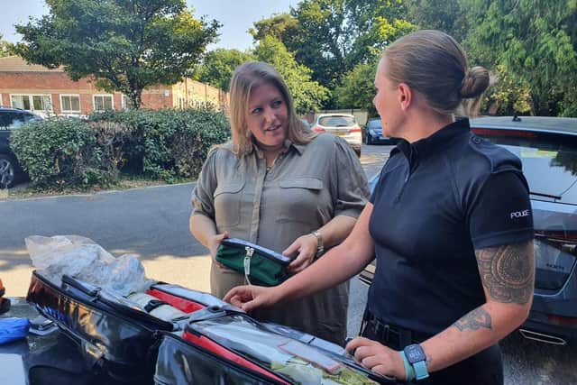 Hampshire police and crime commissioner Donna Jones, left, with a police dog unit officer and some of the new first aid and trauma kits bought for dog handler across Hampshire and Thames Valley
