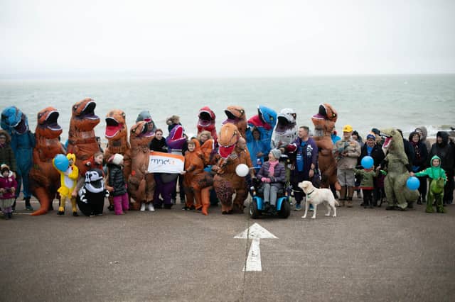 Graeme Lloyd and Tommy Russell completed their 15,000 steps a day challenge. They posed for a photo alongside friends, family and supporters at the finish line.