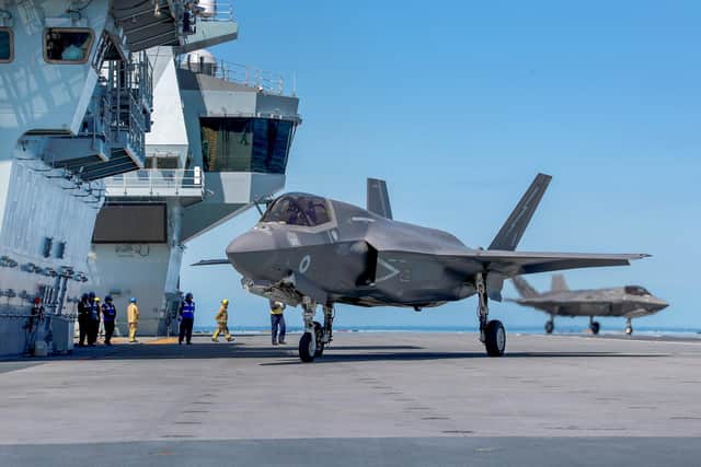 Pictured here is one of  four operational F-35B Lightning Jets landing on HMS Queen Elizabeth for the first carrier sea training in UK waters. Photo: Royal Navy