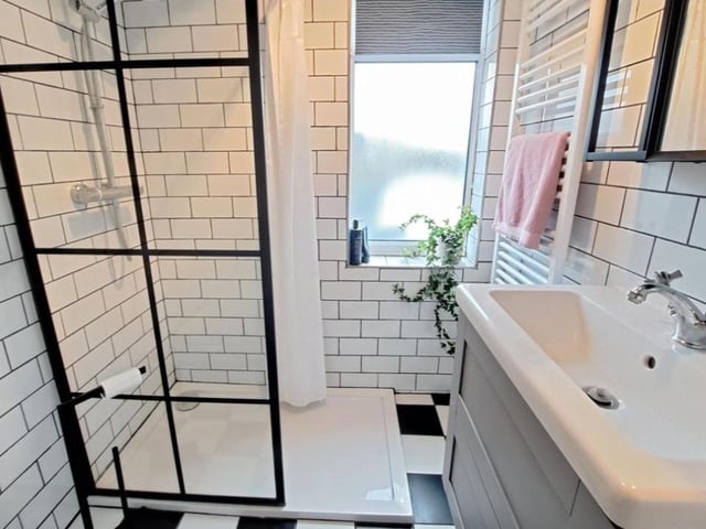 The listing says: "The property is beautifully presented throughout with the internal accommodation briefly comprising of - entrance porch, hallway, living room with log burner, family room opening into a wonderful modern fitted kitchen/diner with bi fold doors leading to garden, utility room, two beautiful shower rooms and three bedrooms."