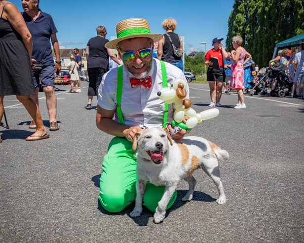 Rob Driscoll (the 'Bow Tie Balloon Guy') with Nelson - the dog who provided the inspiration for his latest creation. Picture: Mike Cooter (240623)