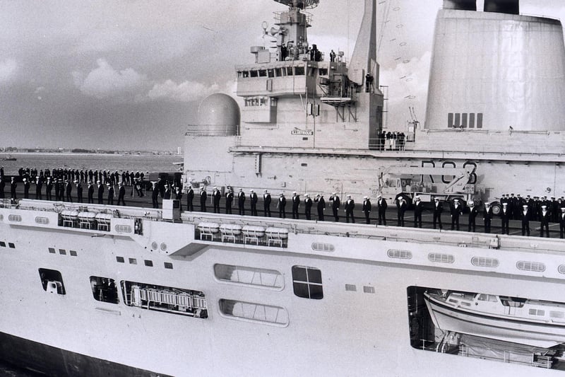 The crew of the HMS Illustrious line the deck as she enters Portsmouth Harbour on her return from the Falkland Islands.