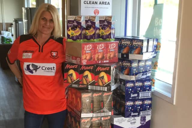 AFC Portchester volunteer Penny with some of the Easter eggs donated by local shops which have been delivered to members of the local community