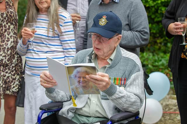 Ian Hawkins with a card from the Queen. 

Picture: Habibur Rahman