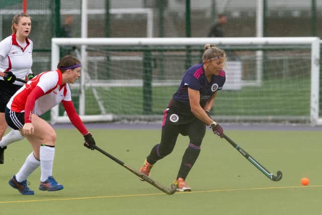 Katie Pond, right, hit a hat-trick as Portsmouth 2nds thrashed Blandford & Sturminster. 
Picture: Keith Woodland