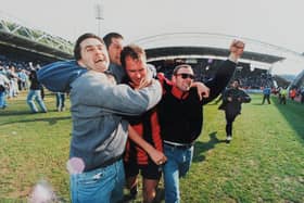 Pompey fans celebrate on the pitch at Huddersfield Town in 1996. One of the photos featured in the forthcoming exhibition at the University of Portsmouth's Ravelin Sports Centre. Picture: Steve Reid