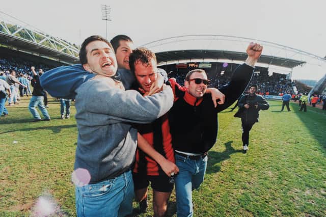 Pompey fans celebrate on the pitch at Huddersfield Town in 1996. One of the photos featured in the forthcoming exhibition at the University of Portsmouth's Ravelin Sports Centre. Picture: Steve Reid