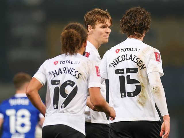 Pompey celebrate Sean Raggett's late winner at Ipswich. Picture: Nigel Keene