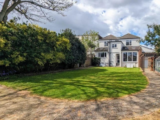 The listing says: "The rear garden is in our opinion a great size with a conservatory, greenhouse, summerhouse and so much more."
