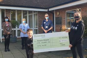 Helen Wallis from TADAA made a donation to Rowans Hospice after the charity helped the family of one of her young students. Pictured: Helen Wallis, right, with Seb Healey, 4, handing over the cheque to the team