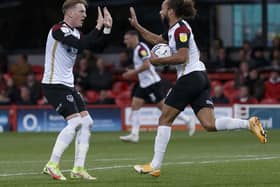 Marcus Harness celebrates with Ronan Curtis after netting Pompey's late leveller at Accrington. Picture: Daniel Chesterton/phcimages.com