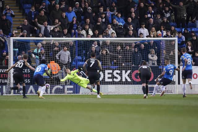 Jonson Clarke-Harris scores Peterborough's second from the spot today.