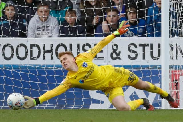 Pompey goalkeeper Alex Bass makes a save against Peterborough. Picture: Joe Pepler