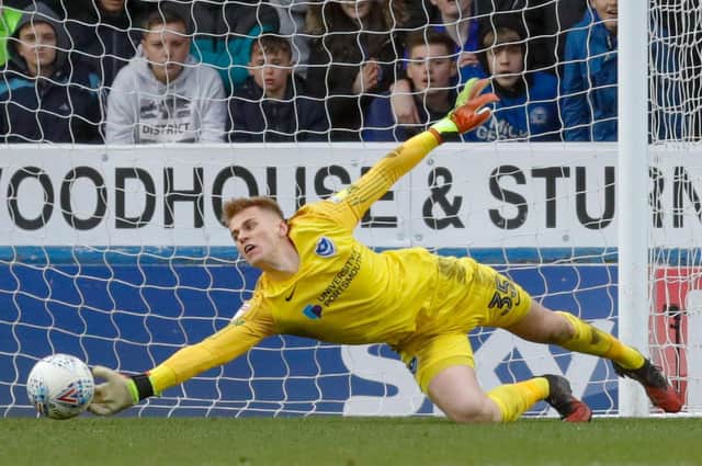 Pompey goalkeeper Alex Bass makes a save against Peterborough. Picture: Joe Pepler