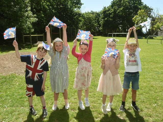 Alverstoke Infant School celebrating The Queen's Platinum Jubilee. From left: Harry Ellwood (6), Clara Rice (5), Lucy Twigg (7), Esther Davis (7) and Sonny Smith (7).
