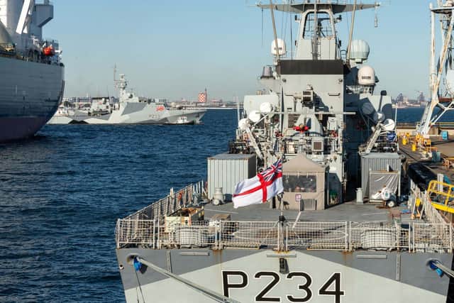 HMS Tamar passes HMS Spey in Japan