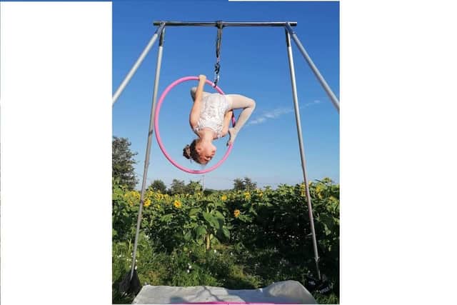 Bella Hounsell, 9, practising on her aerial frame
