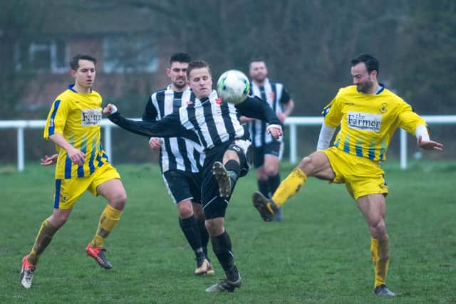 Clanfield (yellow) in Hampshire Premier League action against Hayling United in 2018 - the Humbugs are a club that current Clanfield boss Lee Blakely would love to emulate. Picture: Vernon Nash