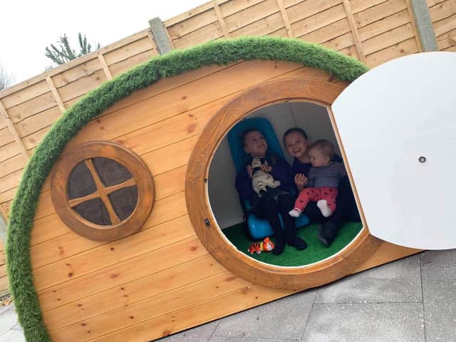 Olivia, Gracie and Eliza Millerchip enjoying their new playhouse that was donated by PS Timber
