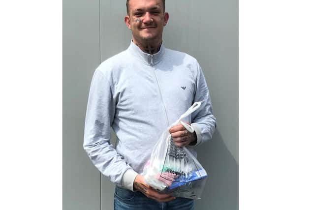 A young girl named Sophie, 8, saved up her pocket money to buy gifts for people living in the homeless pods in Gosport. Pictured: Liam, one of the pod residents, said it was the 'cutest thing ever'