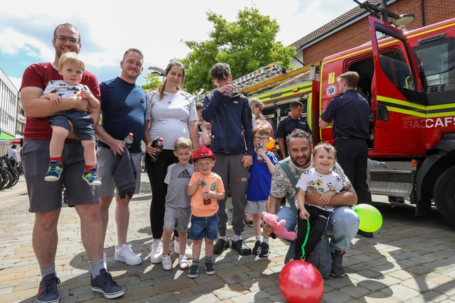 Families queue to sit inside a fire engine at Fareham 999 Day, West Street, Fareham.Picture: Chris Moorhouse (220624-19)
