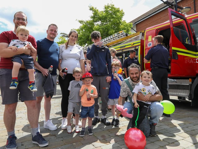 Families queue to sit inside a fire engine at Fareham 999 Day, West Street, Fareham.Picture: Chris Moorhouse (220624-19)